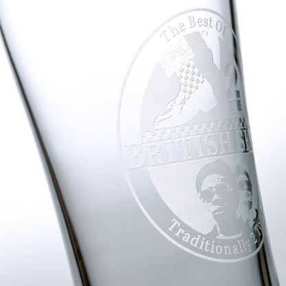 close up detail of sandblast engraving on a tall british ska pint glass