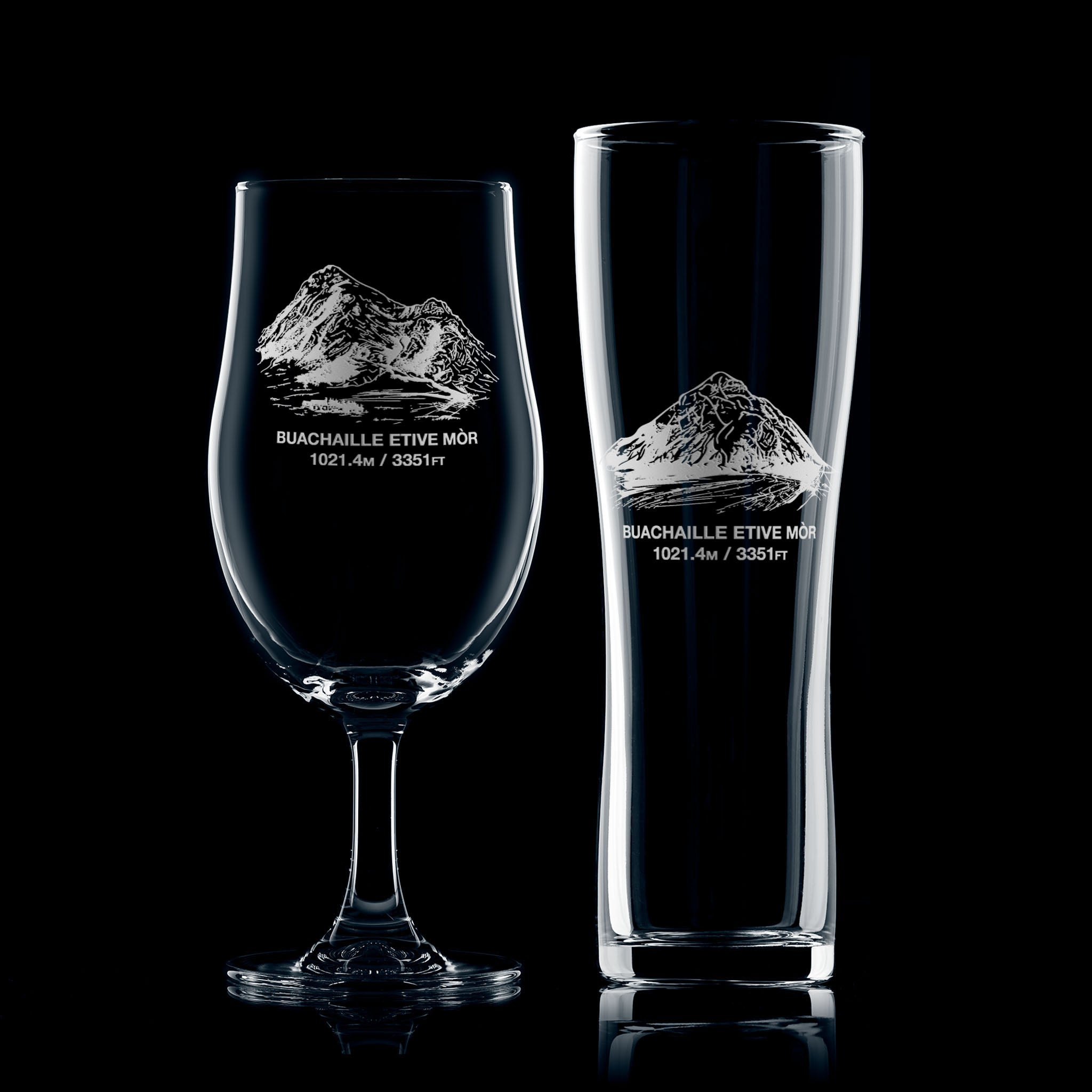 Stemmed beer glass and pint glass engraved with Buachaille Etive Mòr, photographed on a white background