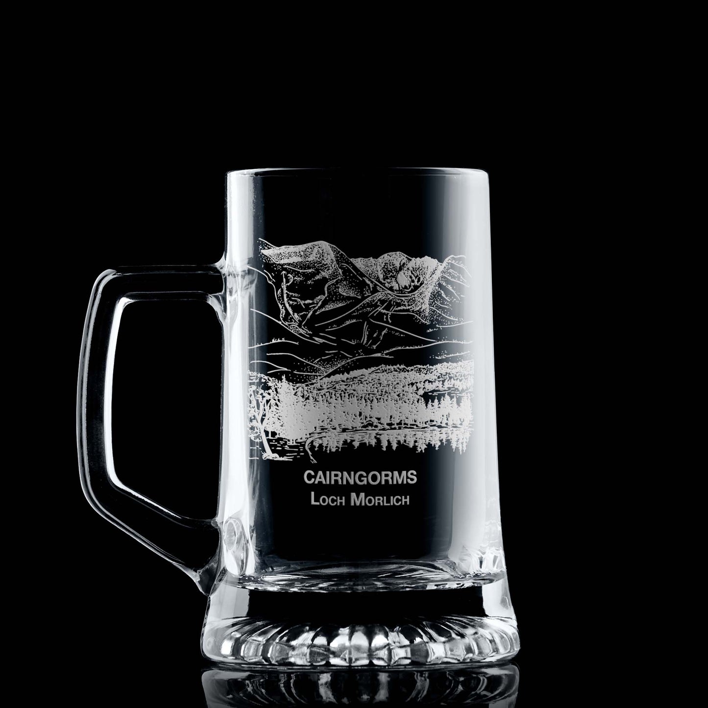 Engraved tankard with Cairngorms and Loch Morlich design shown on black background, handle on left of engraving