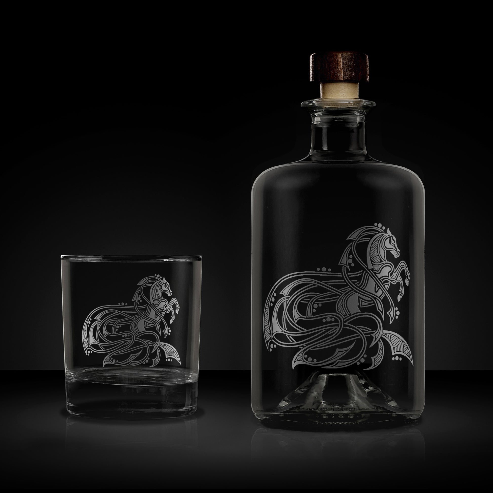 etched apothecary bottle and whisky glass engraved with viking horse or kelpie