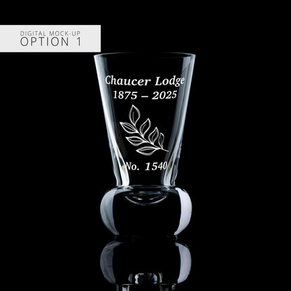 Clear glass mock-up with engraved text and design on a black background