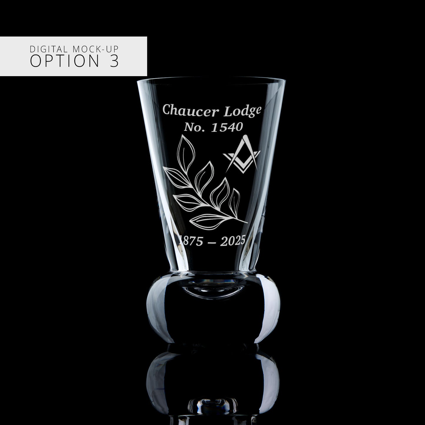 Glass with engraved design and text on a black background