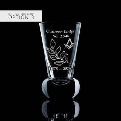 Glass with engraved design and text on a black background