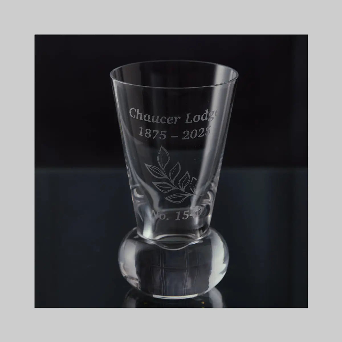Finished firing glass engraved with Chaucer Lodge crest — photographed in our Fife studio.