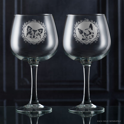 Two gin glases with engraved long haired and short haired chihuahua portraits framed with leafy garland