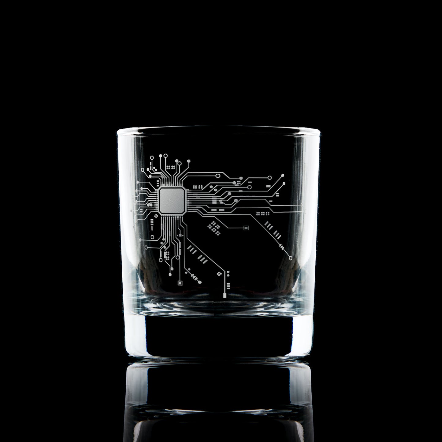 Engraved whisky glass with circuit board design, tech-inspired