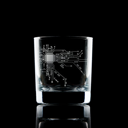 Engraved whisky glass with circuit board design, tech-inspired