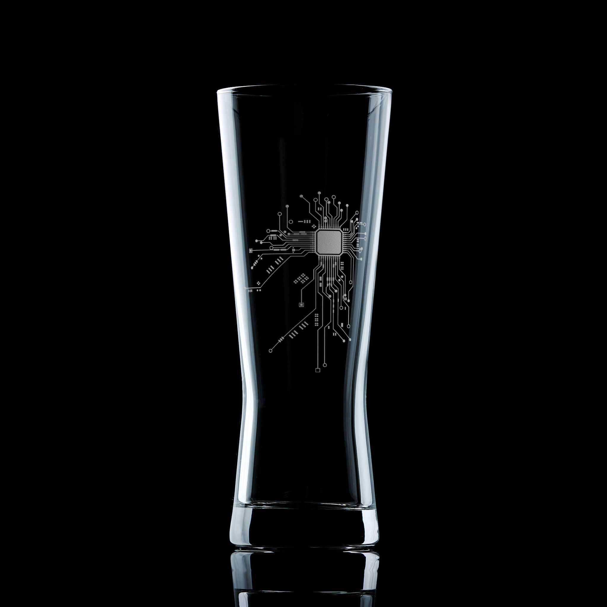 Engraved pint glass featuring a detailed circuit board design, hand-etched for tech lovers, engineers, and coders. Tall shape ideal for lager and craft beer.