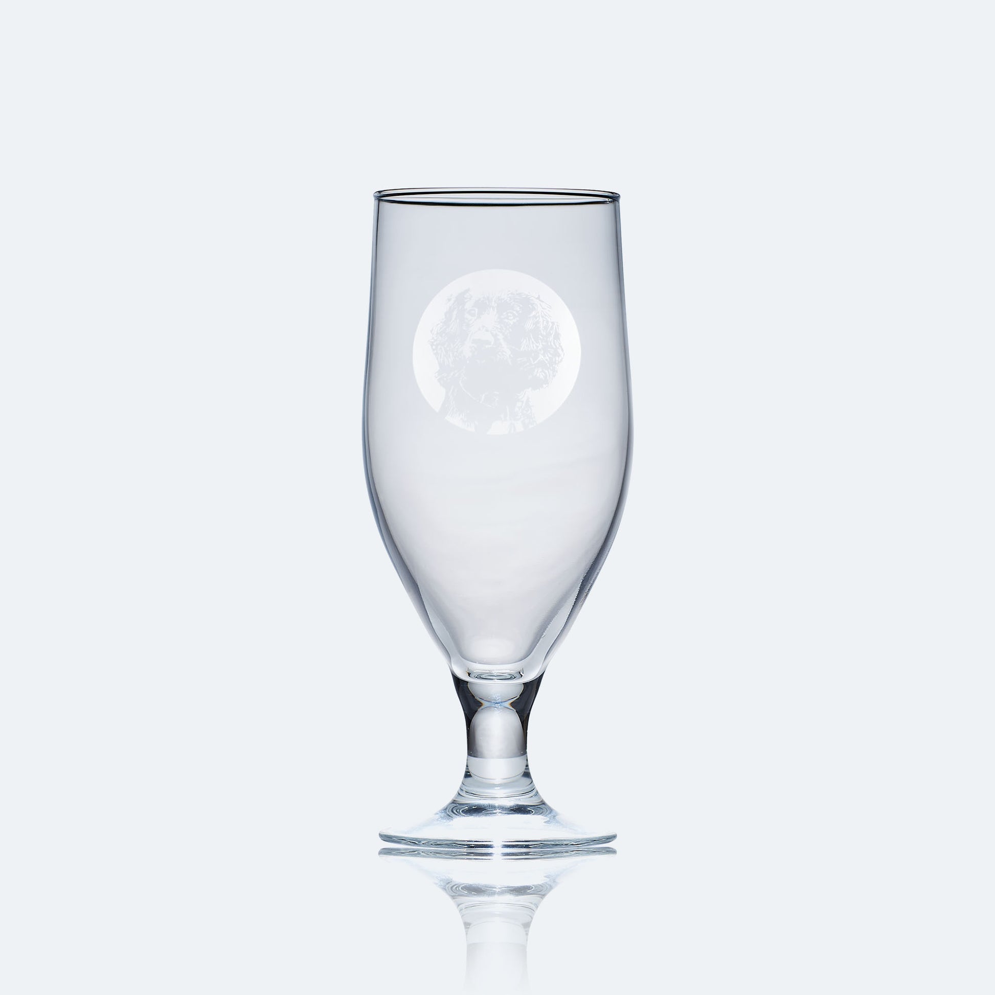 engraved chalice style stemmed beer glass etched with a portrait of a working cocker spaniel dog