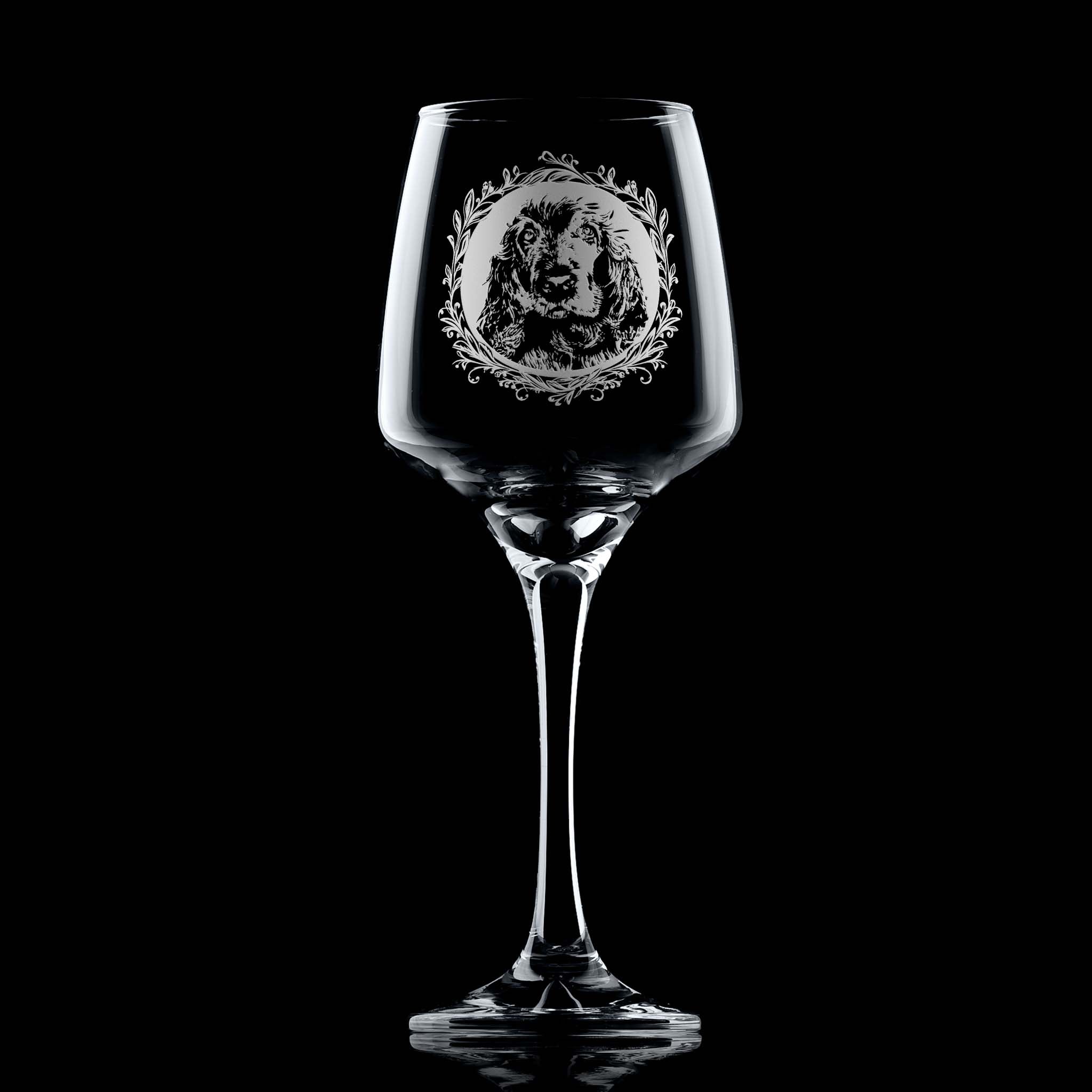 Wine glass with engraved show cocker spaniel portrait in circular frame with leafy garland