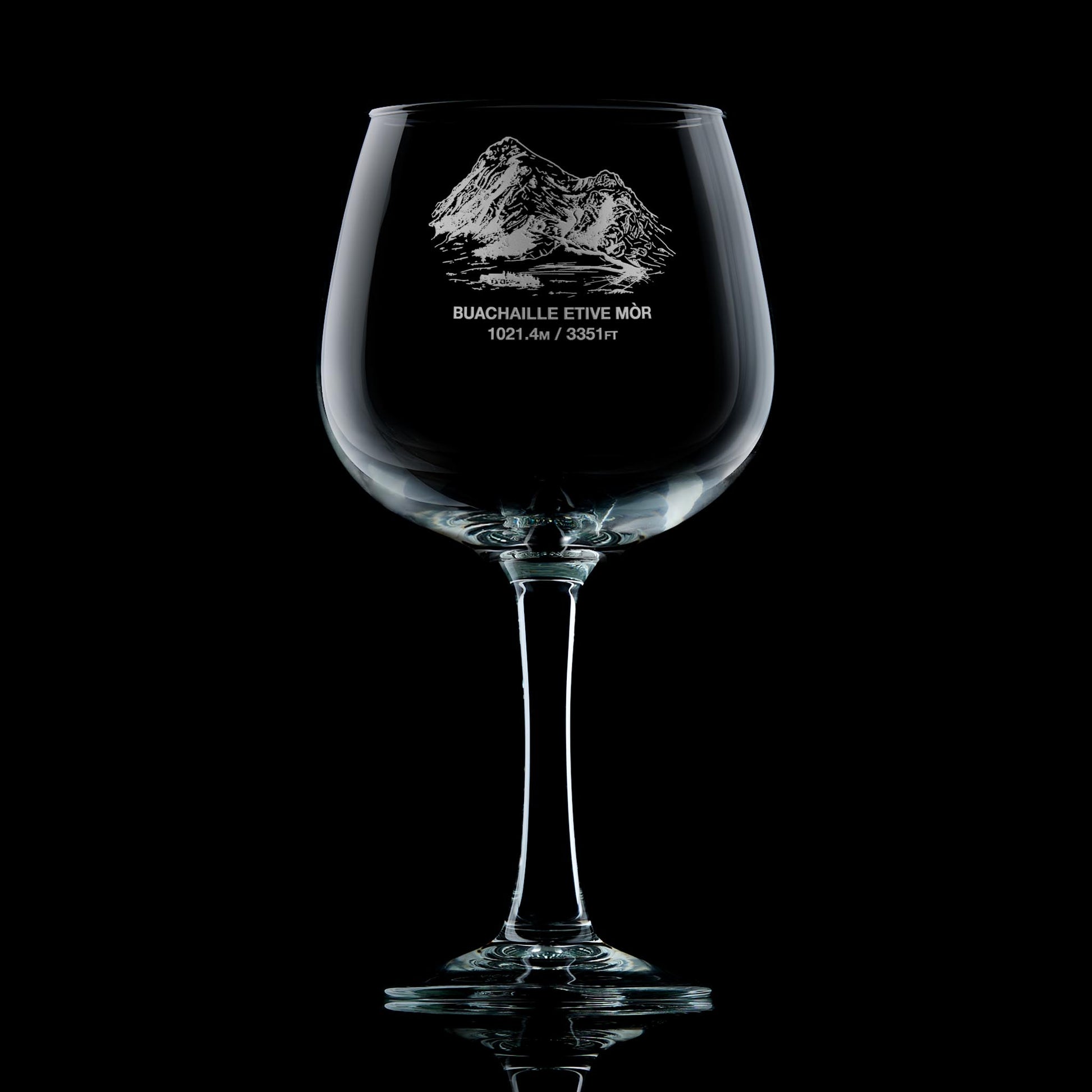 Stemmed gin glass engraved with Coire na Tulaich on Buachaille Etive Mòr, photographed on a black background