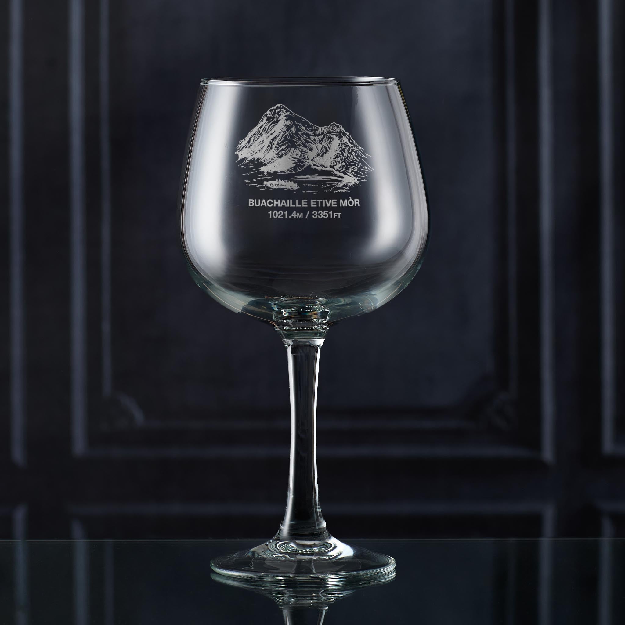Stemmed gin glass engraved with Coire na Tulaich on Buachaille Etive Mòr, photographed in situ