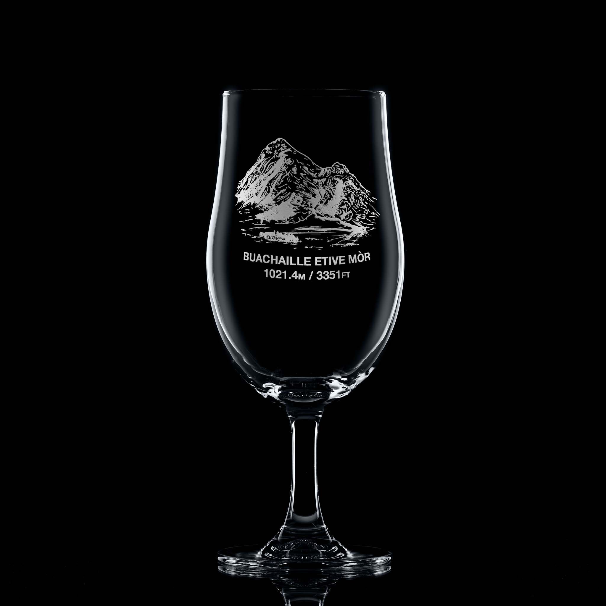 Large stemmed beer glass engraved with Coire na Tulaich on Buachaille Etive Mòr, photographed on a black background