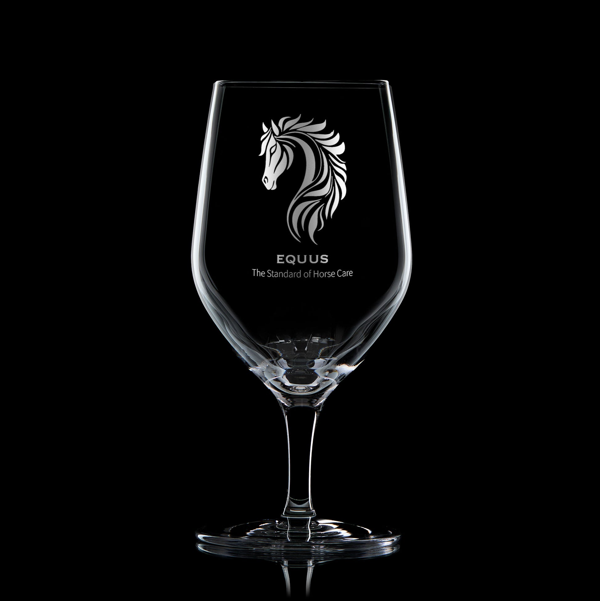 business logo mineral water glass engraved with corporate strapline on a black background