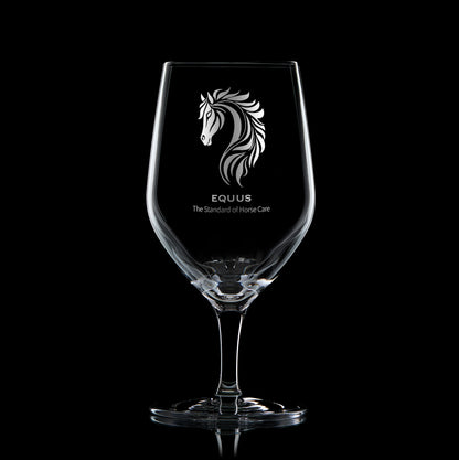 business logo mineral water glass engraved with corporate strapline on a black background