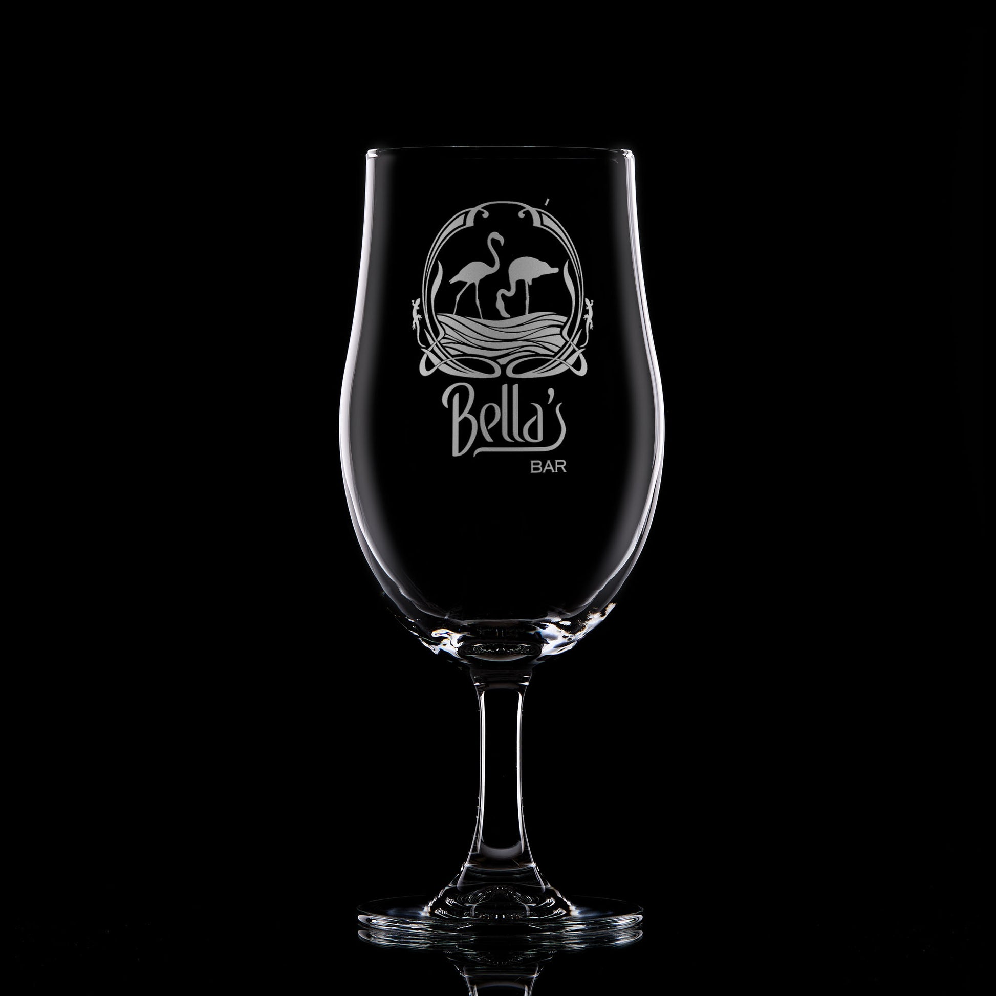 Pint stemmed beer glass featuring an intricate engravng of a corporate logo