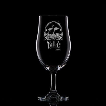 Pint stemmed beer glass featuring an intricate engravng of a corporate logo