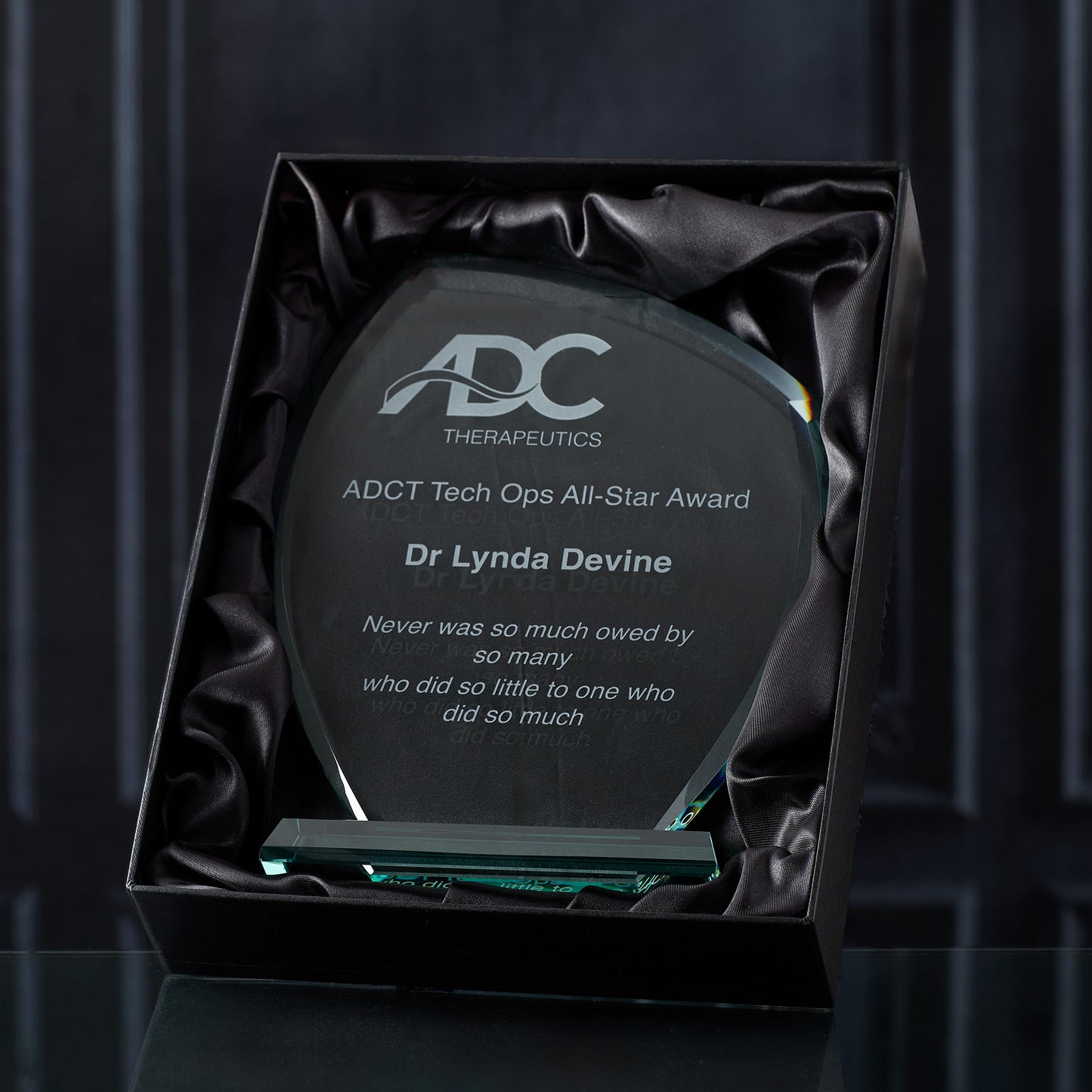 Large jade glass leaf award, customised with logo and text in a black satin lined presentation box