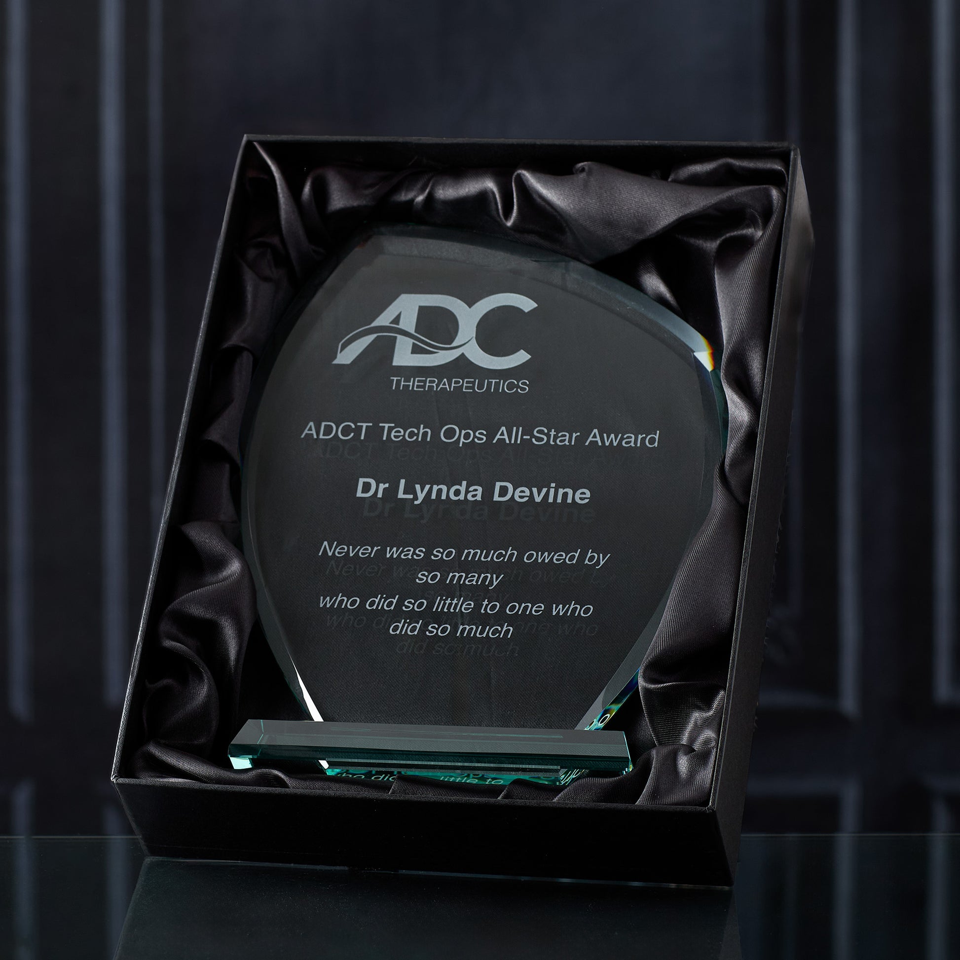 Large jade glass leaf award, customised with logo and text in a black satin lined presentation box