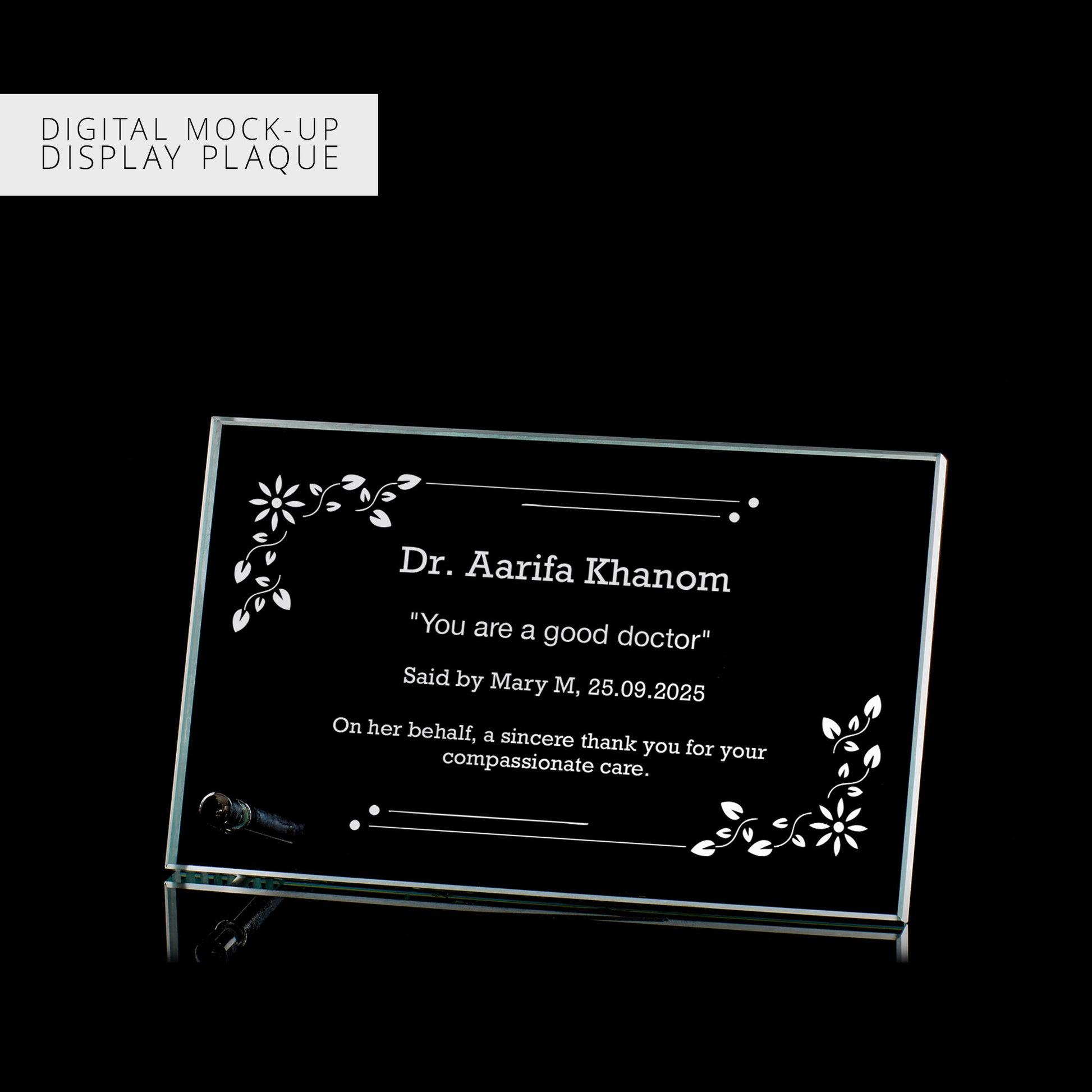Digital mock-up of a glass plaque with engraved text on a black background