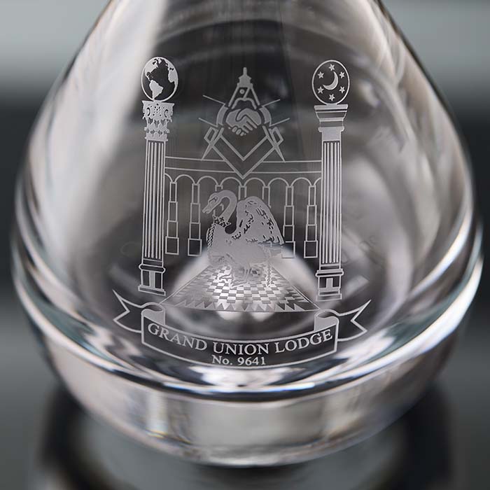 Clear glass object with engraved Masonic design and 'Grand Union Lodge No. 9641' text.