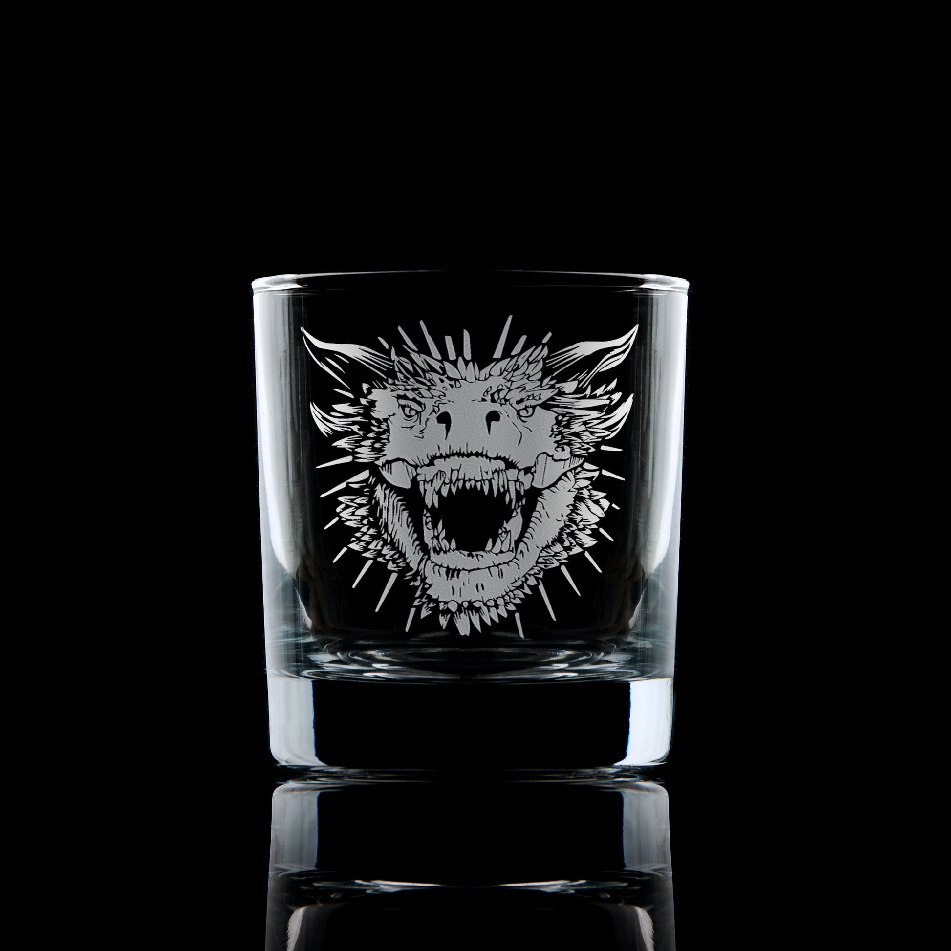 whisky glass engraved with a portraint of a dragon