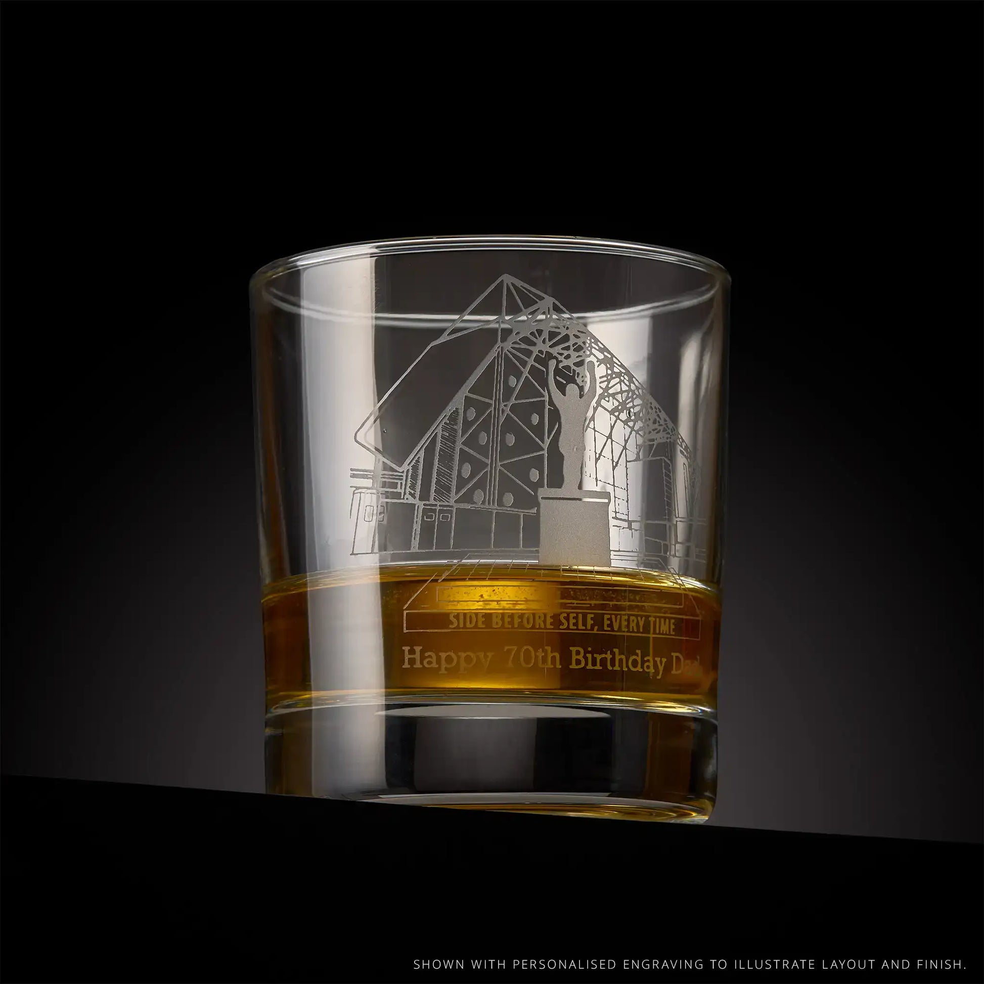 Etched glass tumbler with engraved Ellan Road Stadium design and text, on a black background.