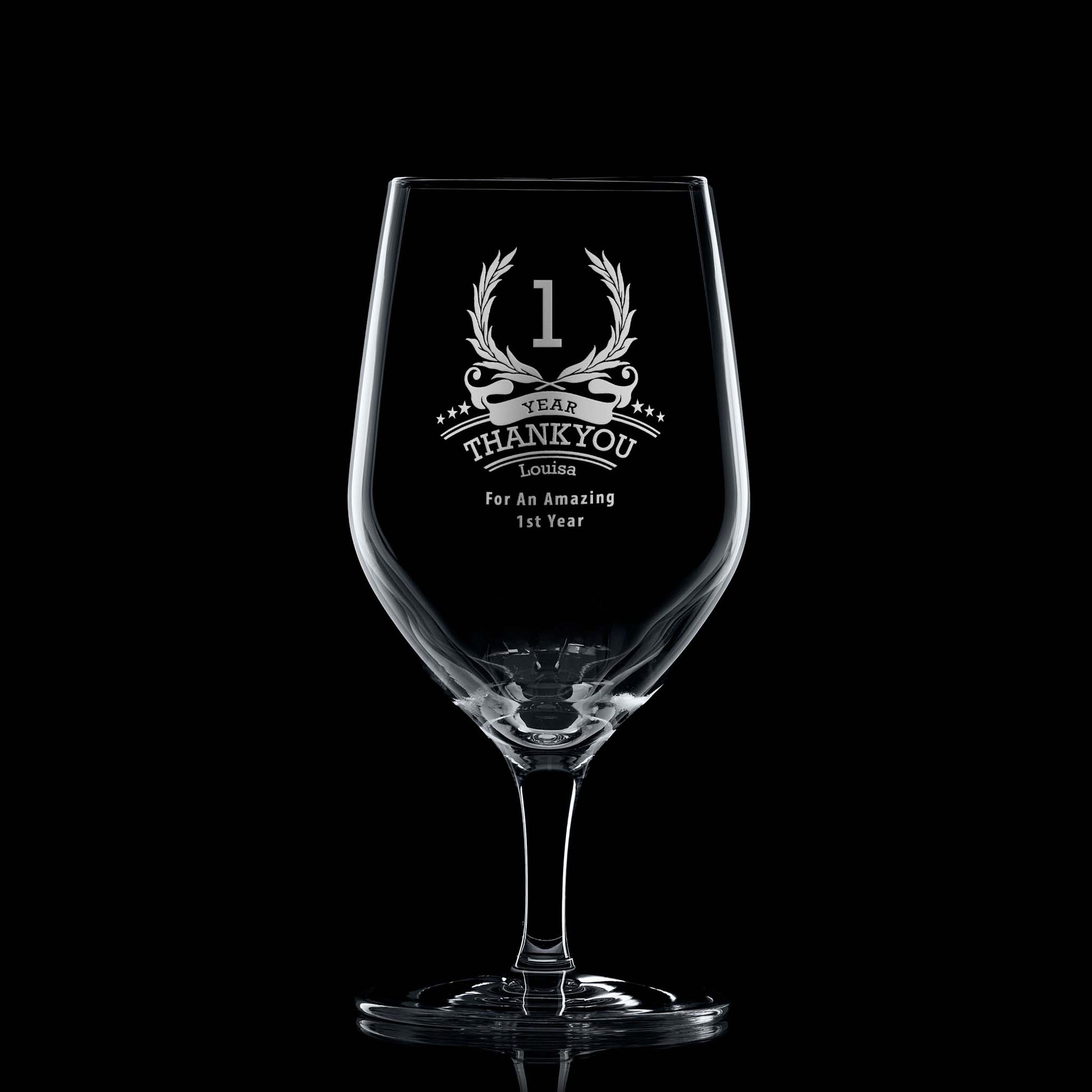 One-year employee recognition whisky glass engraved with wreath, stars, and personal message