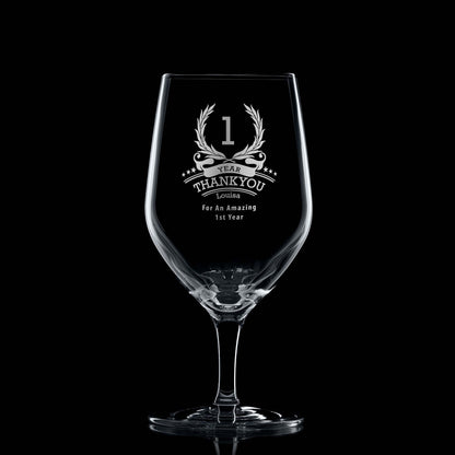 One-year employee recognition whisky glass engraved with wreath, stars, and personal message