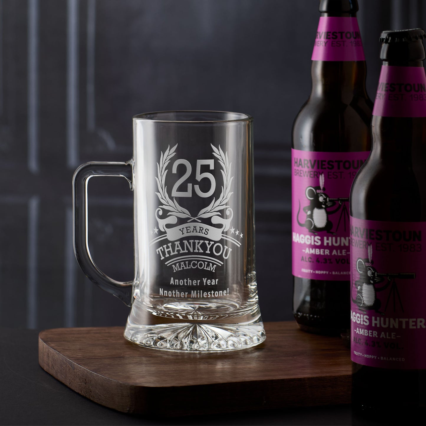 Engraved tankard with the number ‘25’ inside a laurel wreath, surrounded by stars, with personalised name and message
