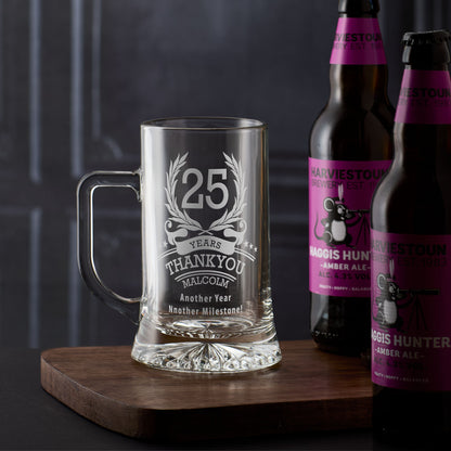 Engraved tankard with the number ‘25’ inside a laurel wreath, surrounded by stars, with personalised name and message