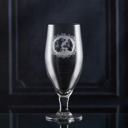 Stemmed beer glass with engraved english springer spaniel framed with a leafy garland