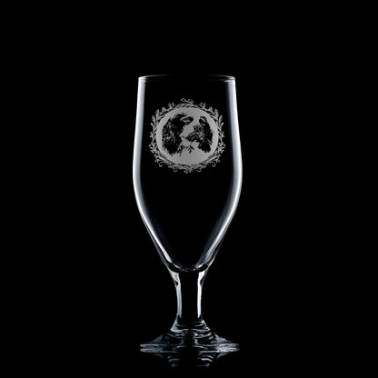 Beer glass engraved with a portrait of a Springer Spaniel on a black background