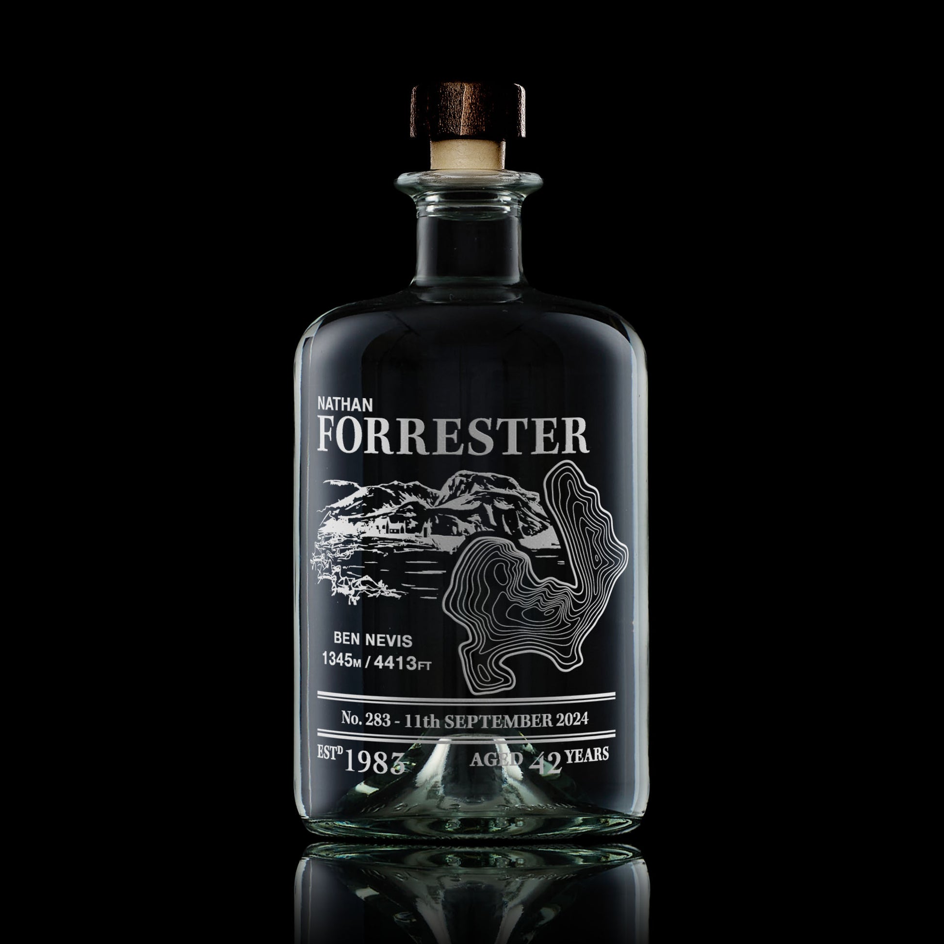 Apothecary-style decanter engraved with Ben Nevis, photographed on a black background