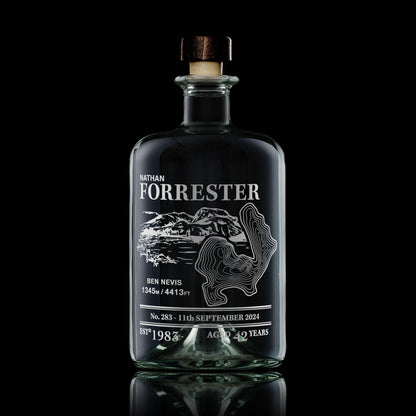 Apothecary-style decanter engraved with Ben Nevis, photographed on a black background