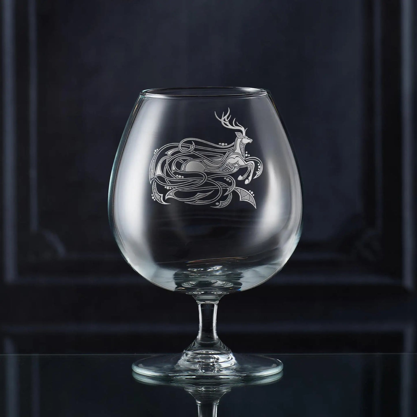 Engraved brandy glass featuring a Celtic stag and knotwork design, handmade in Scotland.