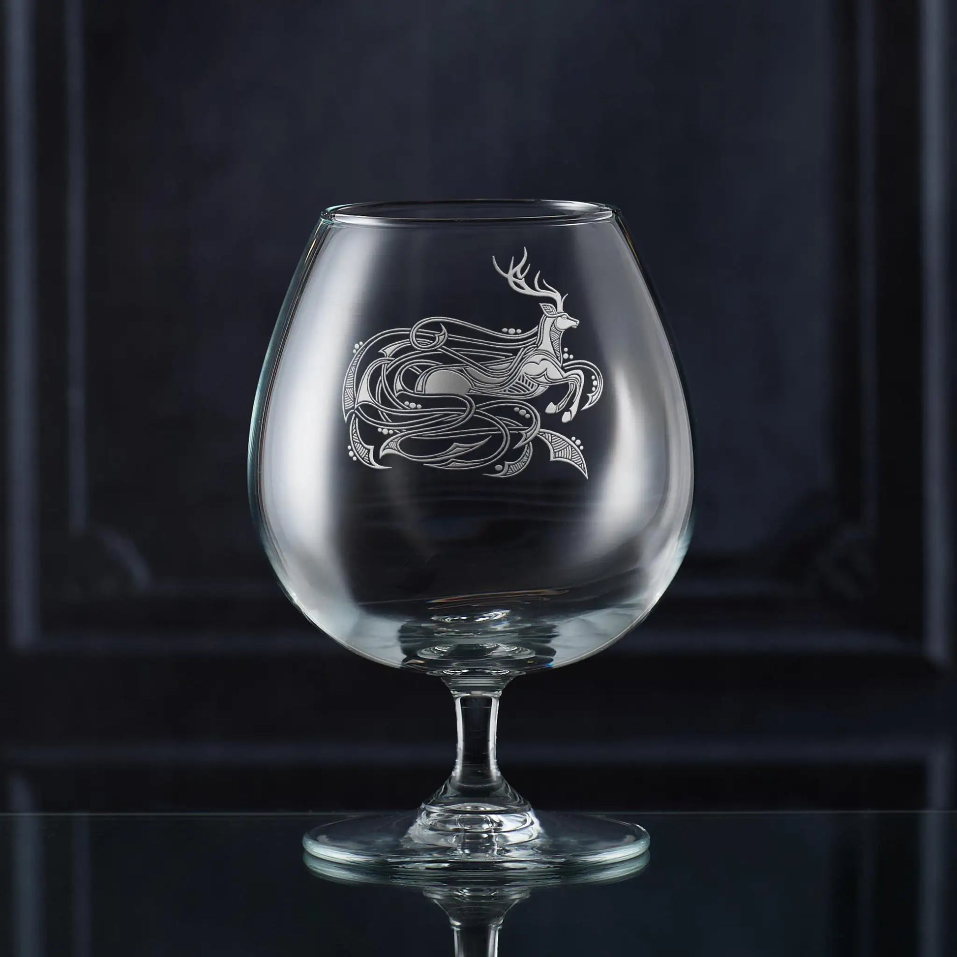 Engraved brandy glass featuring a Celtic stag and knotwork design, handmade in Scotland.