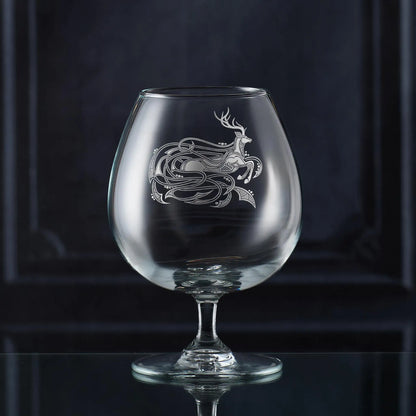 Engraved brandy glass featuring a Celtic stag and knotwork design, handmade in Scotland.