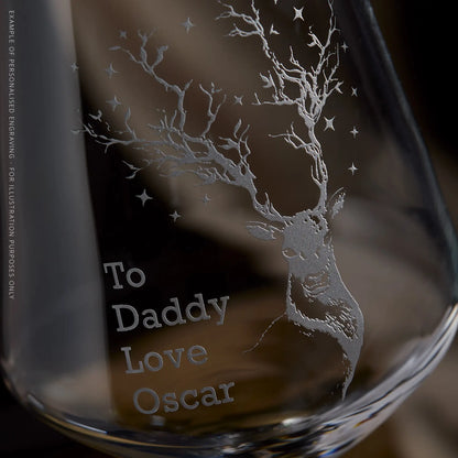 Engraving detail of a wine glass with deer design and personalised engraved text on a dark background