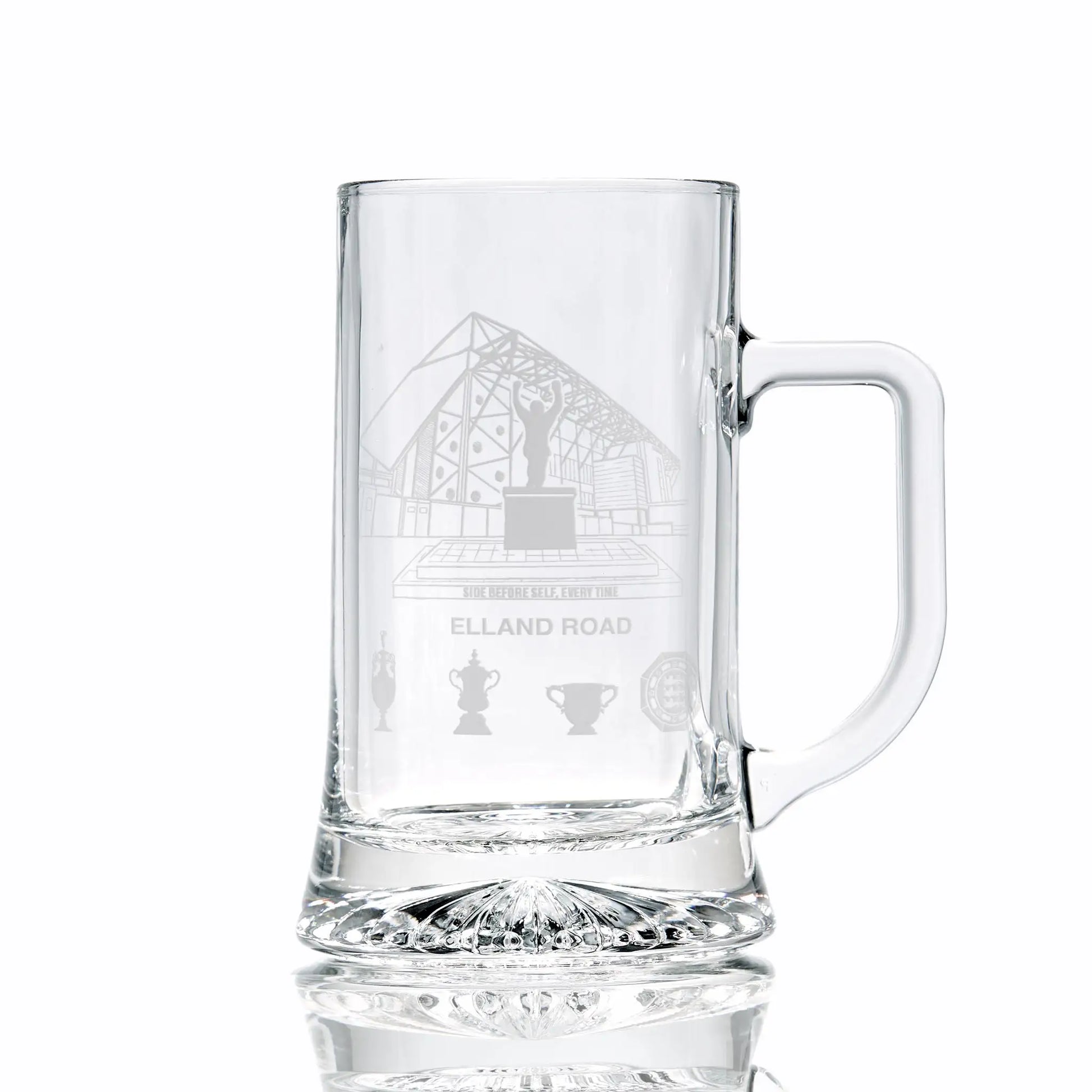 Clear glass tankard engraved with Elland Road stadium, photographed on a white background.