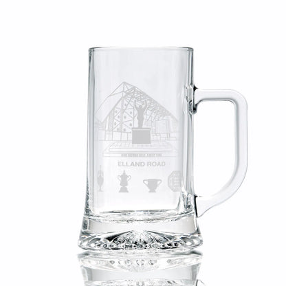 Clear glass tankard engraved with Elland Road stadium, photographed on a white background.