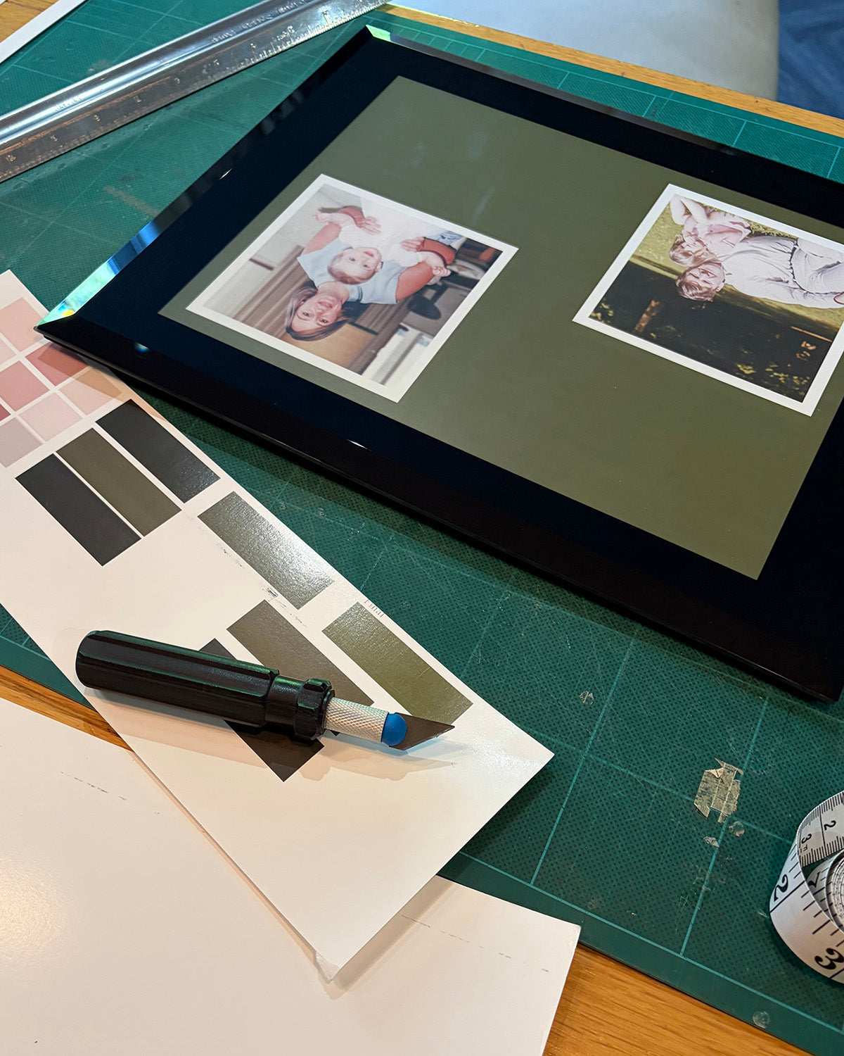 Print colour tests used to refine the dark green background for the archival photograph composition