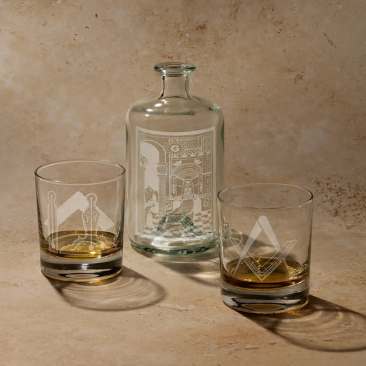 Fellowcraft 2nd Degree gift set featuring engraved apothecary decanter bottle with tracing board design and two whisky glasses with Square and Compass and working tools.