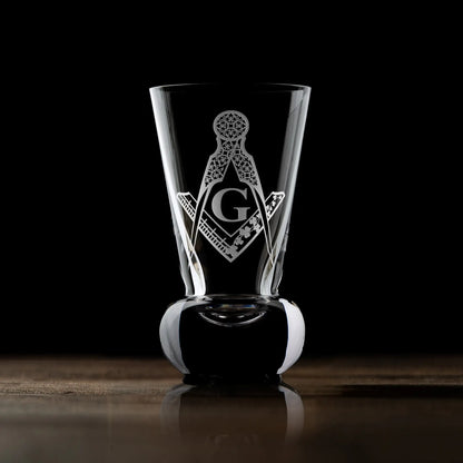 Masonic firing glass with Irish Constitution Past Master engraving on dark background