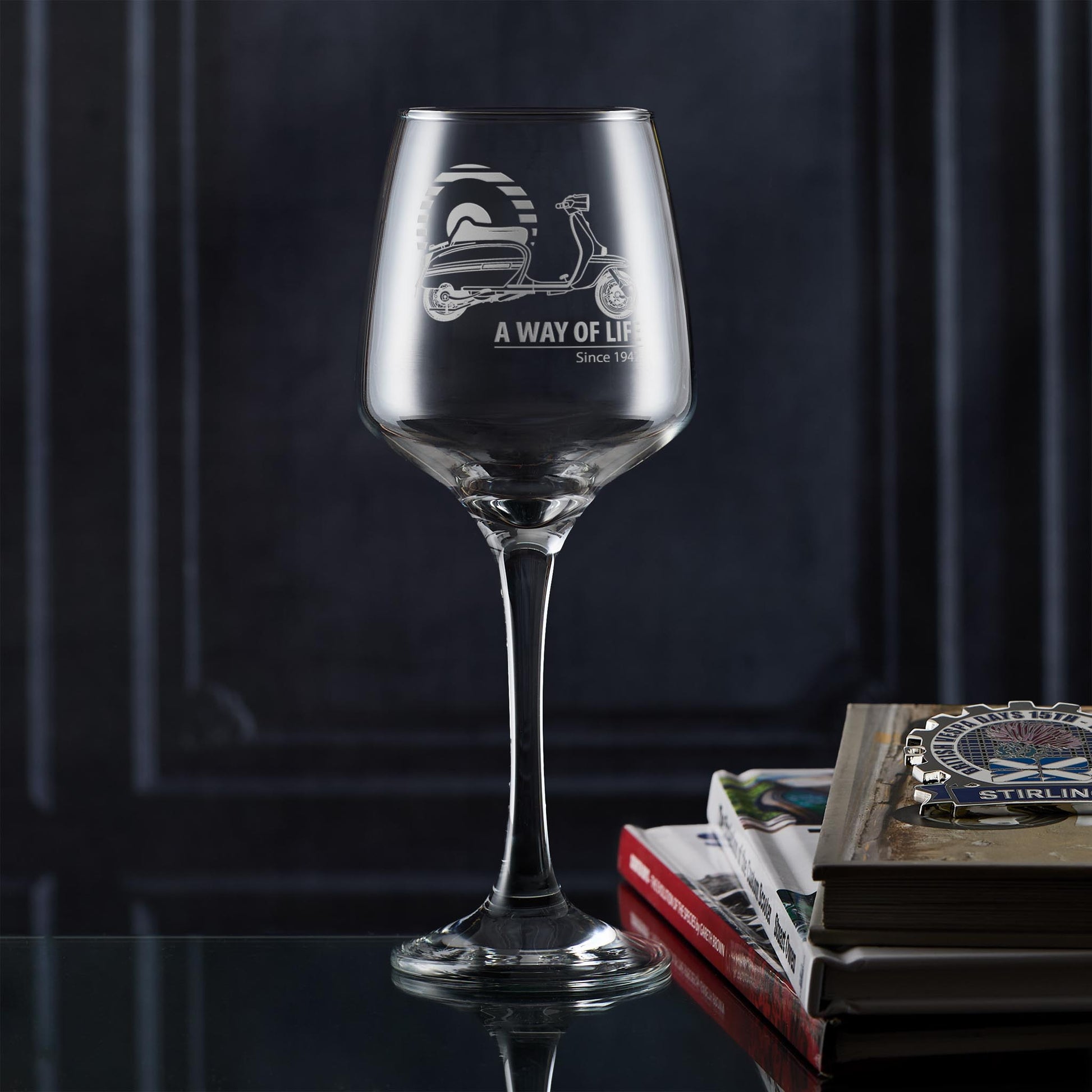Personalised wine glass engraved with Lambretta GP scooter and Mod target design, photographed in lifestyle setting