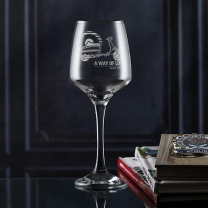 Personalised wine glass engraved with Lambretta GP scooter and Mod target design, photographed in lifestyle setting