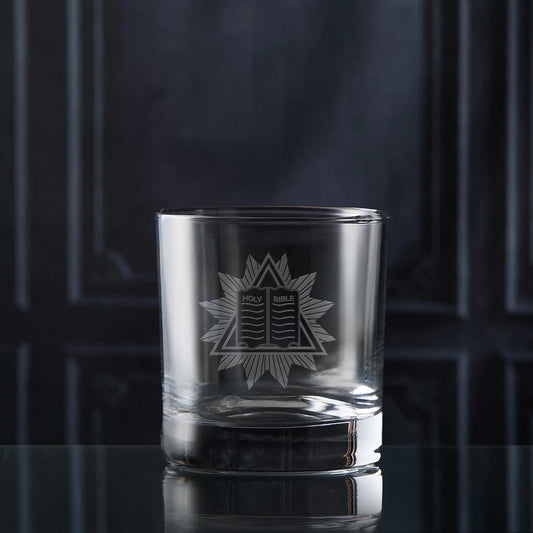 Masonic whisky glass engraved Chaplain collar jewel on a dark background