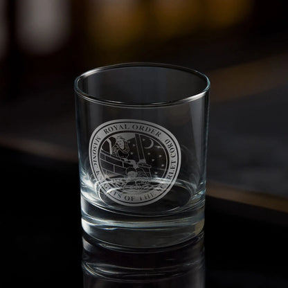 Masonic whisky tumbler with engraved Order of the Scarlet Cord emblem on a dark background