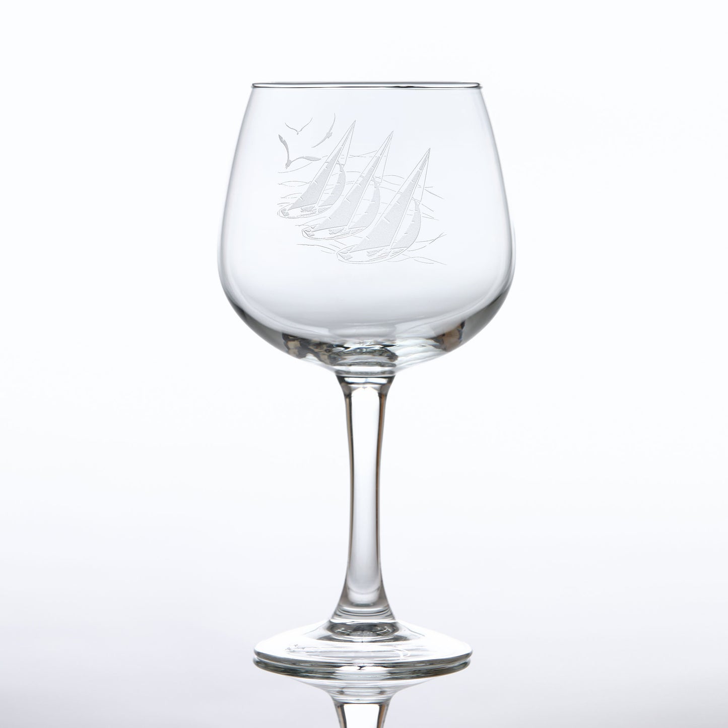 Balloon Gin glass engraved with sailing boats and seabirds.