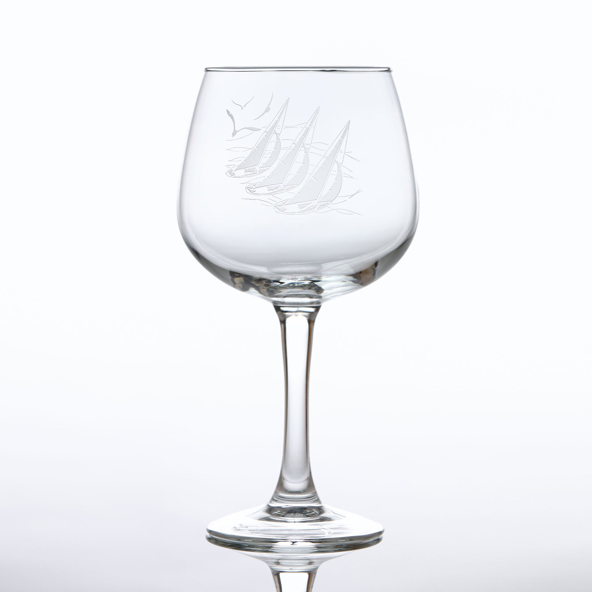 Balloon Gin glass engraved with sailing boats and seabirds.